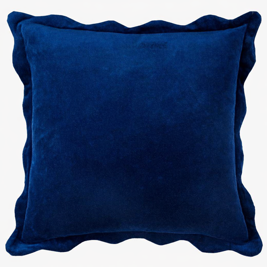 Navy velvet pillow with soft scalloped edges and a plush, rich texture.