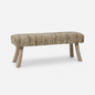 Woven textured ranch‑style bench with a natural fabric seat and light wood legs on a white background.