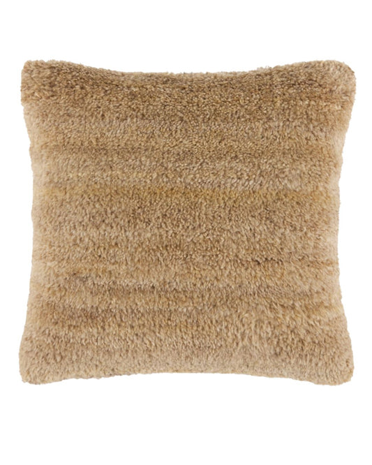 Light tan wool decorative pillow with a soft shaggy texture on a white background.